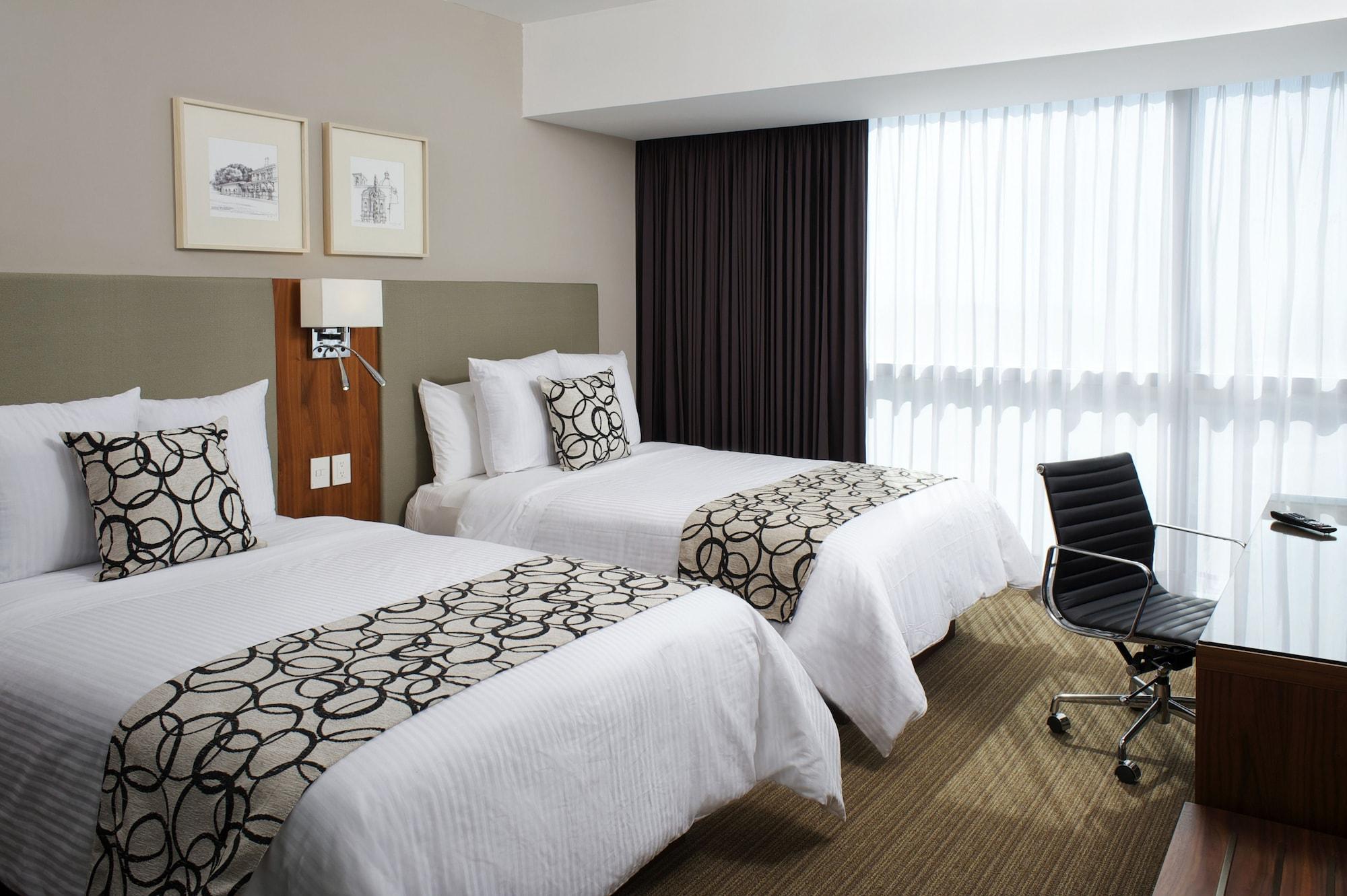 Casa Inn Premium Hotel Queretaro Miranda Esterno foto A room at the hotel